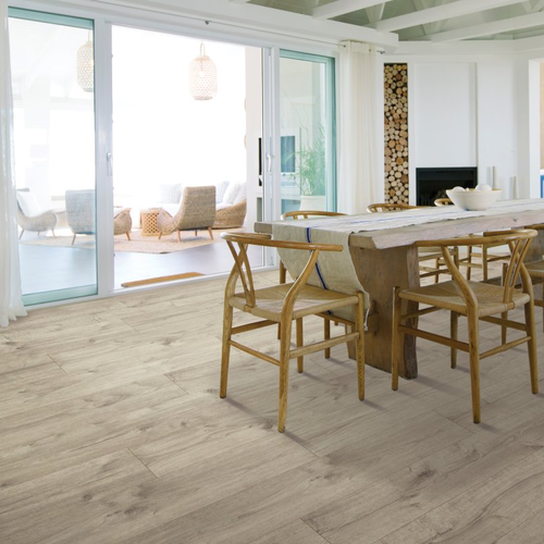 Living room with laminate flooring - Talon Drive in Artifact Oak